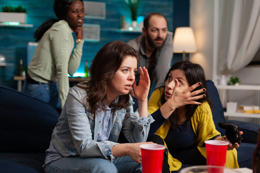 woman-upset-after-lose-online-video-games-while-having-socializing-with-multi-ethnic-group-friends-home-living-room-late-night-drinking-beer-1-1024x683 Eu Odeio Minha Família: O Que Fazer ao Se Sentir Assim?